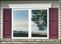 This window has custom raised panel exterior vinyl shutters installed. Raised panel exterior shutters look best when the surface behind the window shutters is very busy such as when installing over brick or narrow vinyl siding.