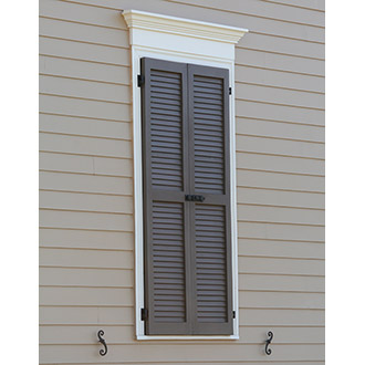 Louvered Shutters Closed Over Window