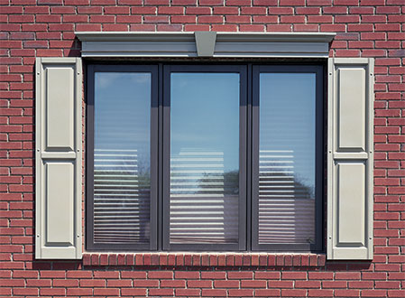 Raised Panel Exterior Shutters on a Brick House