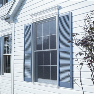 Alcoa Vintage Vinyl Louvered Shutters Installed on Window