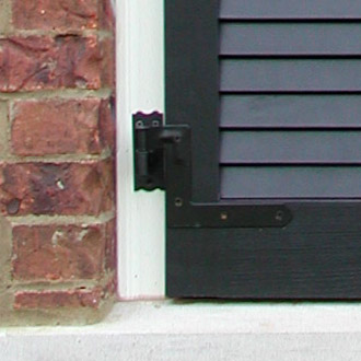 New York Style Hinges Installed on a Brick House