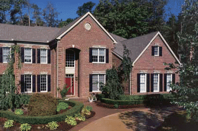 Custom Exterior Vinyl Raised Panel Shutters in Black Installed on a Brick House