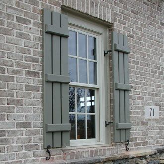 Window with Spaced Board and Batten Wood Shutters