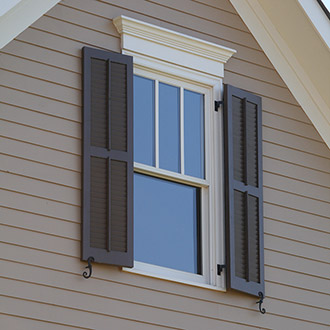 Wooden Louvered Shutters Installed for Fully Functional Use